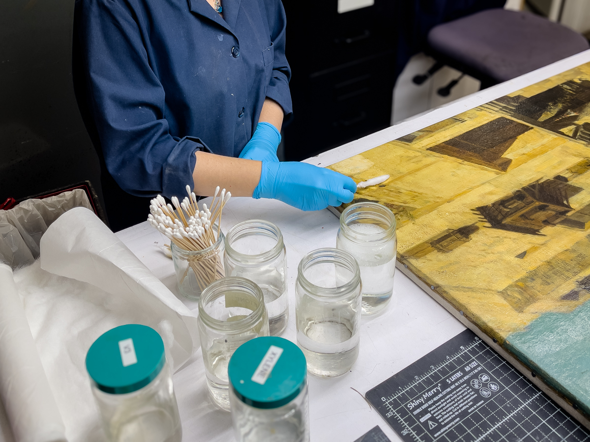 Lowy Conservator Restoring a Painting
