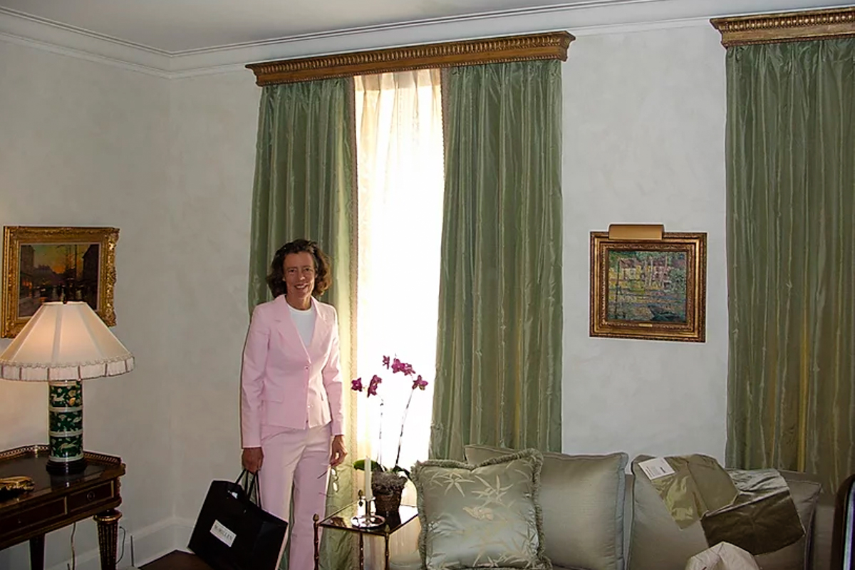 Ann Pyne of McMillen Inc Poses with Install Custom Window Treatments by Lowy