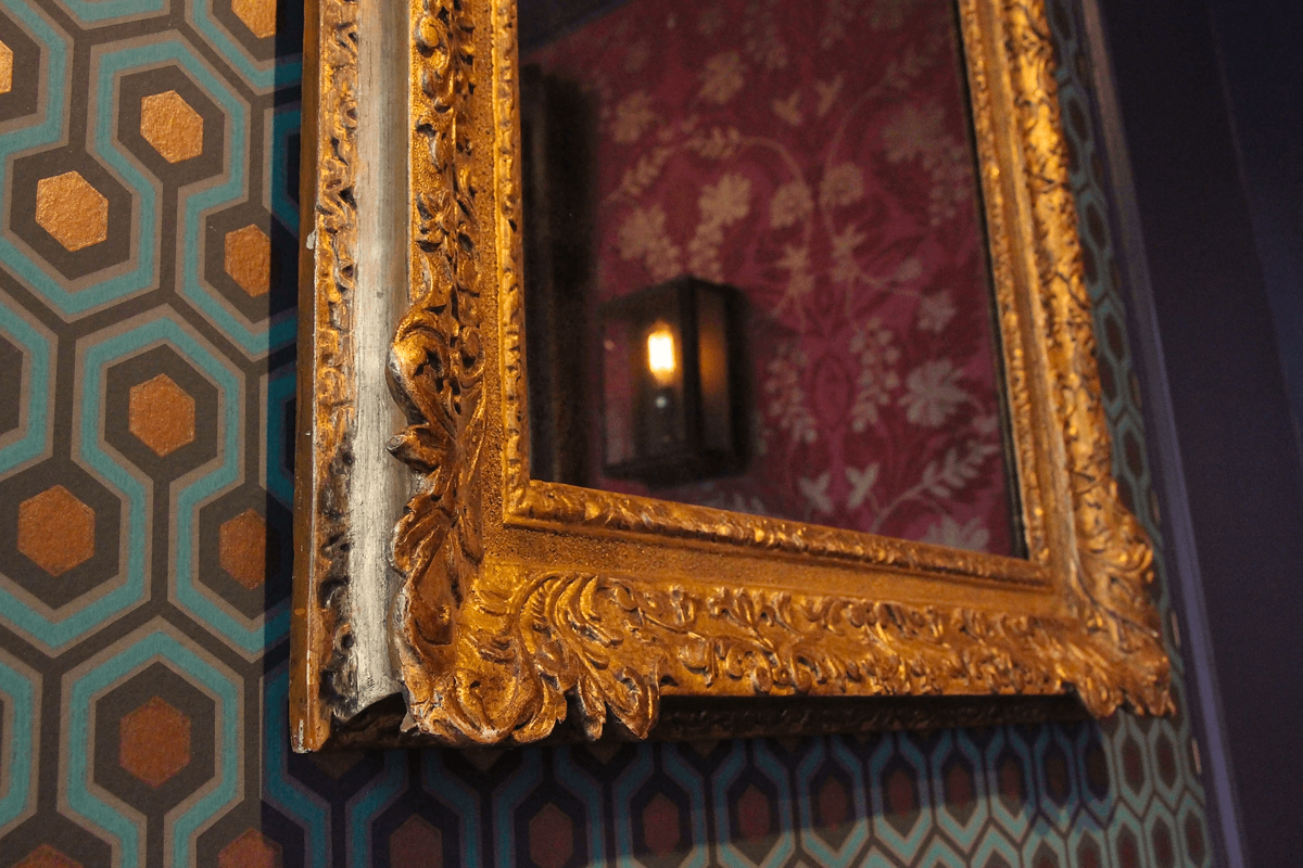 Mirror Fit into an Antique Frame by Lowy
