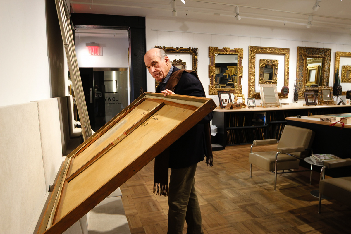 Larry Shar Examines a Painting
