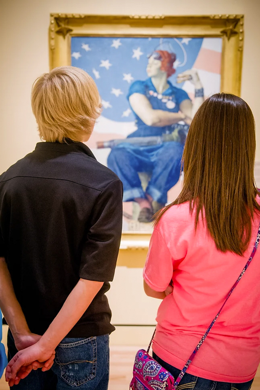 Patrons Viewing Rosie the Riveter by Norman Rockwell