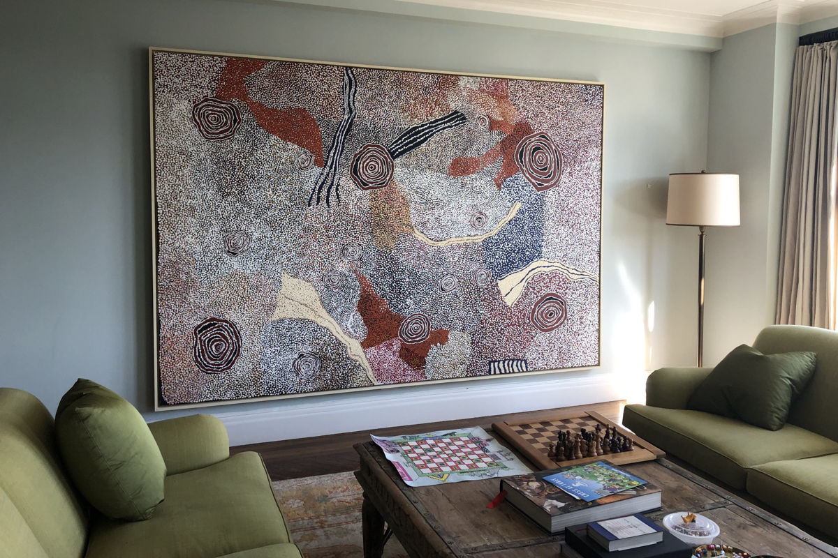Bill Whiskey Tjapaltjarri Painting Rockholes Near the Olgas in Private Residence