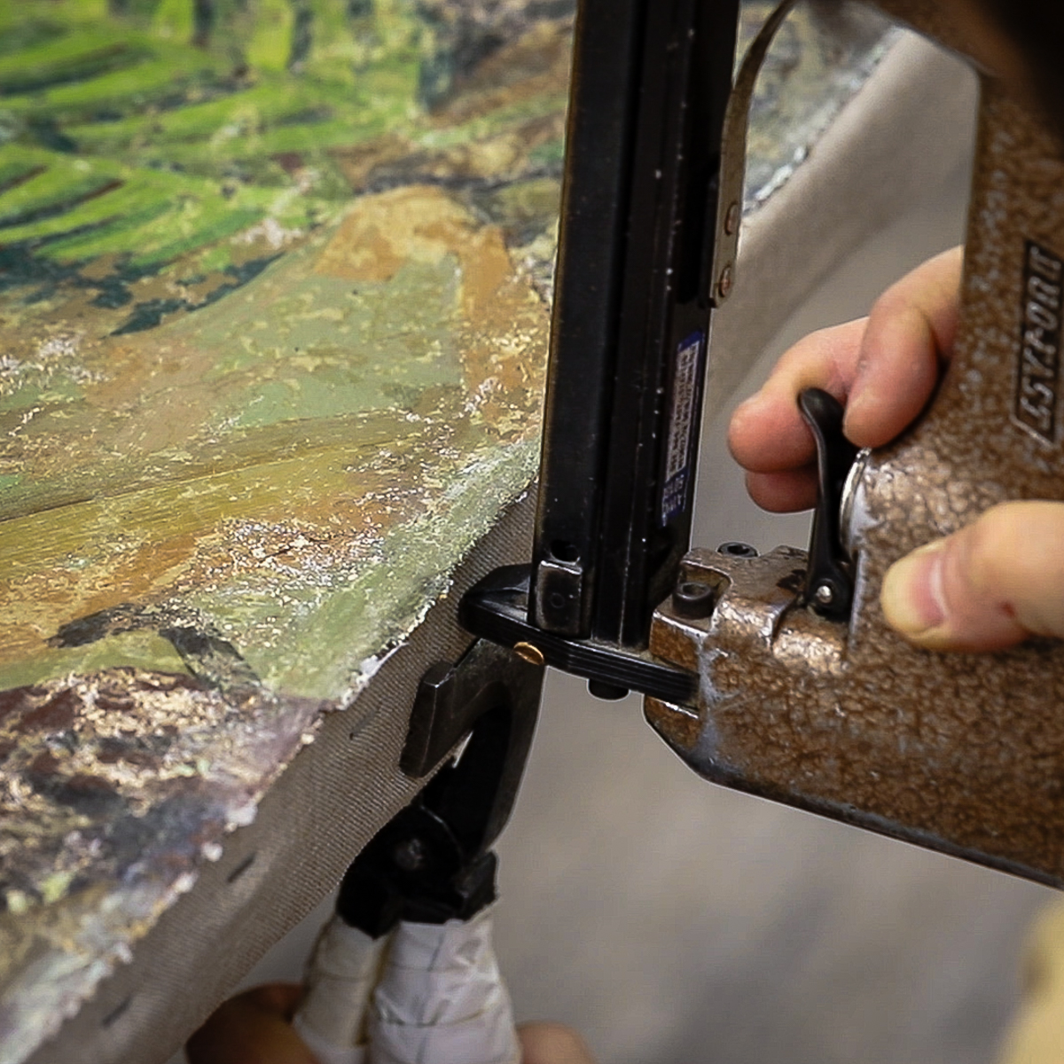 Lowy Conservator Lining a Painting